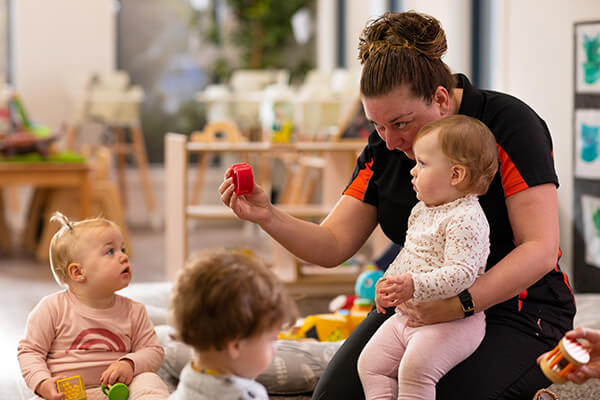 SK-Section-Educators1 Happy parent in Sunkids classroom smiling