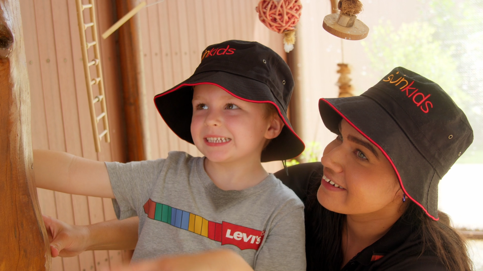 Young happy girl at Sunkids smiling